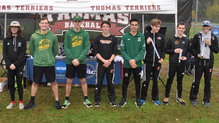 First Team All-Conference runners pose for a photo.