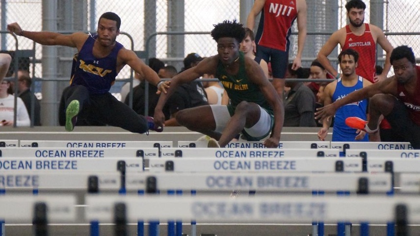 Humphrey Banful clears a hurdle in the beginning stretch of the 60-meter hurdles. 