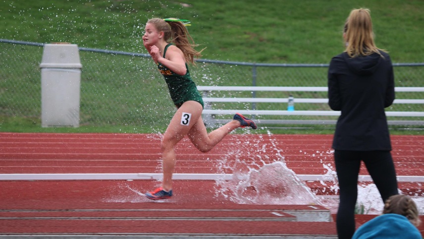 steeplechase runner through the water pit