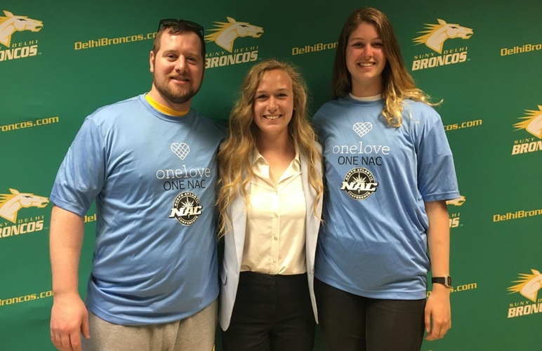 L to R: Swimming and diving head coach Mike Burud, track and field assistant coaches Kelsey Esselman and Lucy Ford, facilitators of SUNY Delhi's One Love initiative.