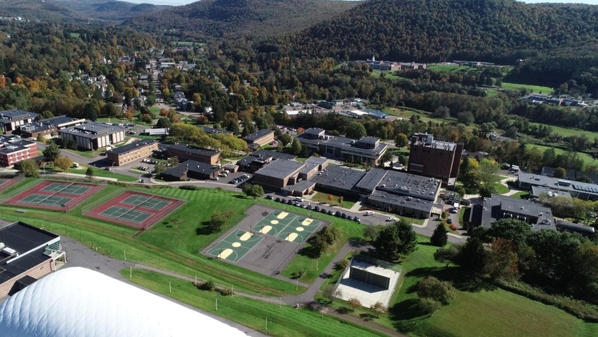 Aerial view of the campus with the athletic facilities in the foreground.