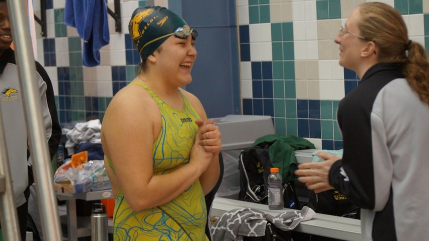 Kaitlyn Quezada celebrates with teammate Julia Witt after a record-breaking race.