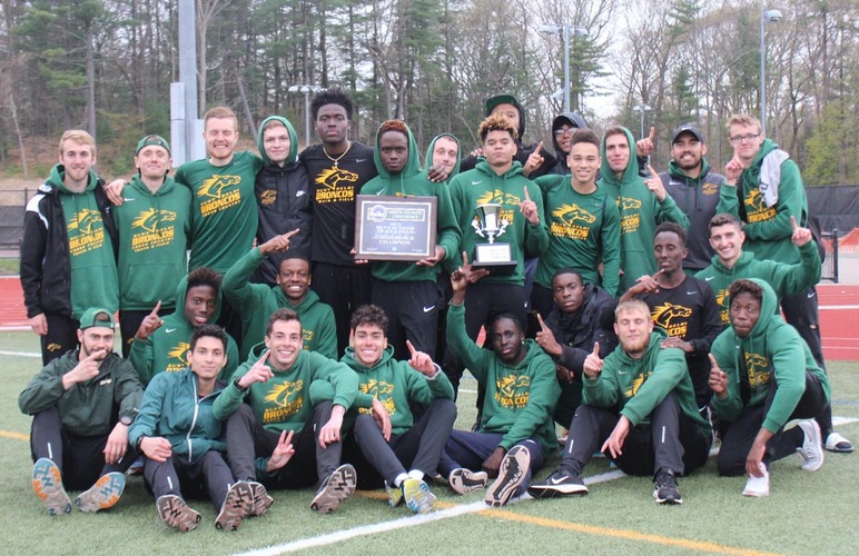 The men's track and field team with their NAC championship awards.