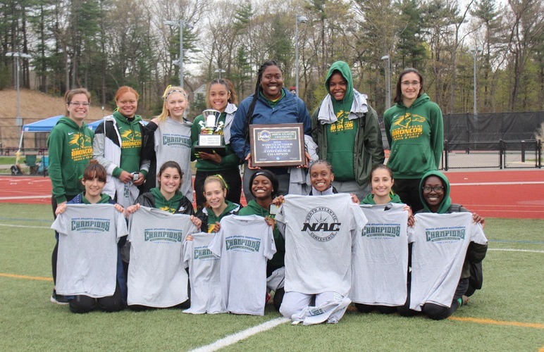 The SUNY Delhi women's track and field team with their NAC championship titles.