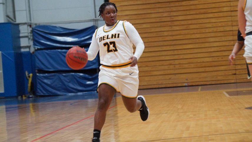Samiaya Salley #23 dribbles the ball up court looking for a teammate to pass the ball to. 