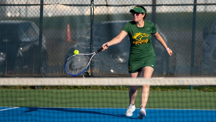 Sarah Krzyston about to make contact with the tennis ball.