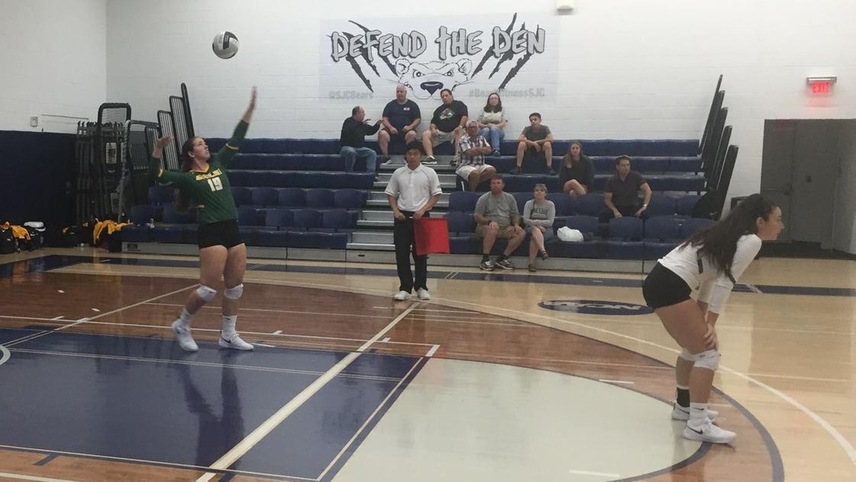 Erica Prindle serving the ball.