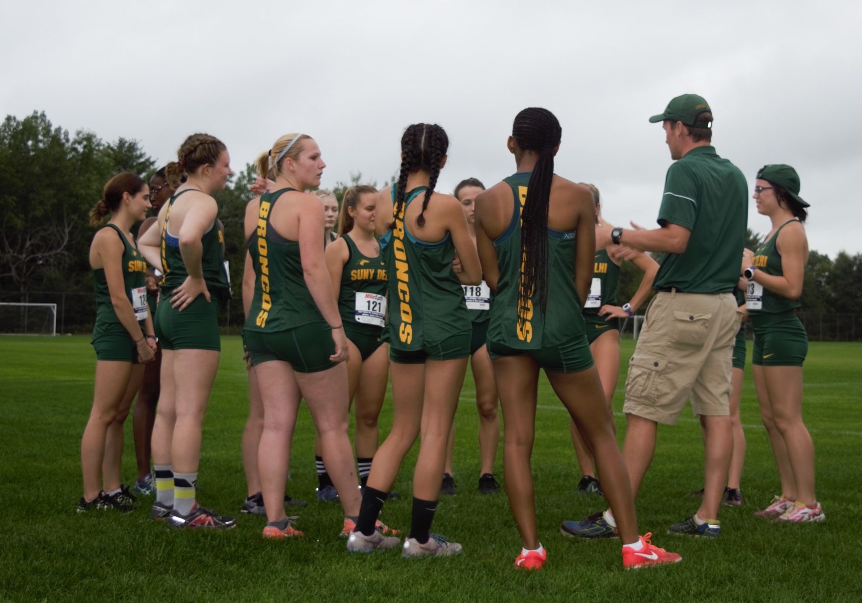 Coach Munro addresses the women prior to their victory Friday.