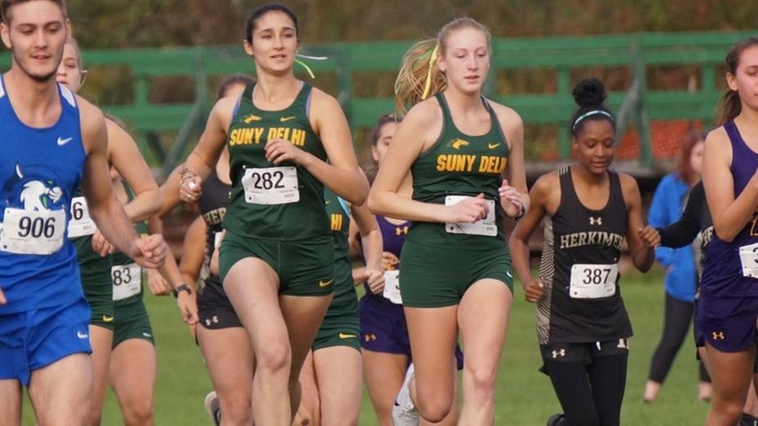 Arielle Moheimani and Shyanne Lawton running out of the starting line to begin a race.